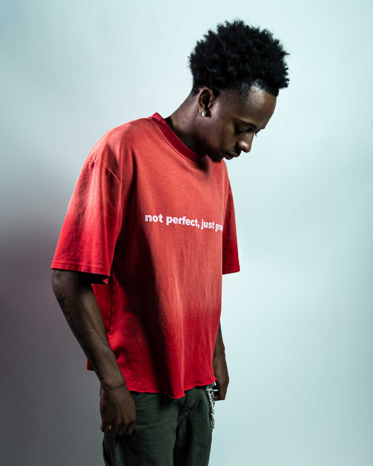 Red "not perfect, just growing" Tee